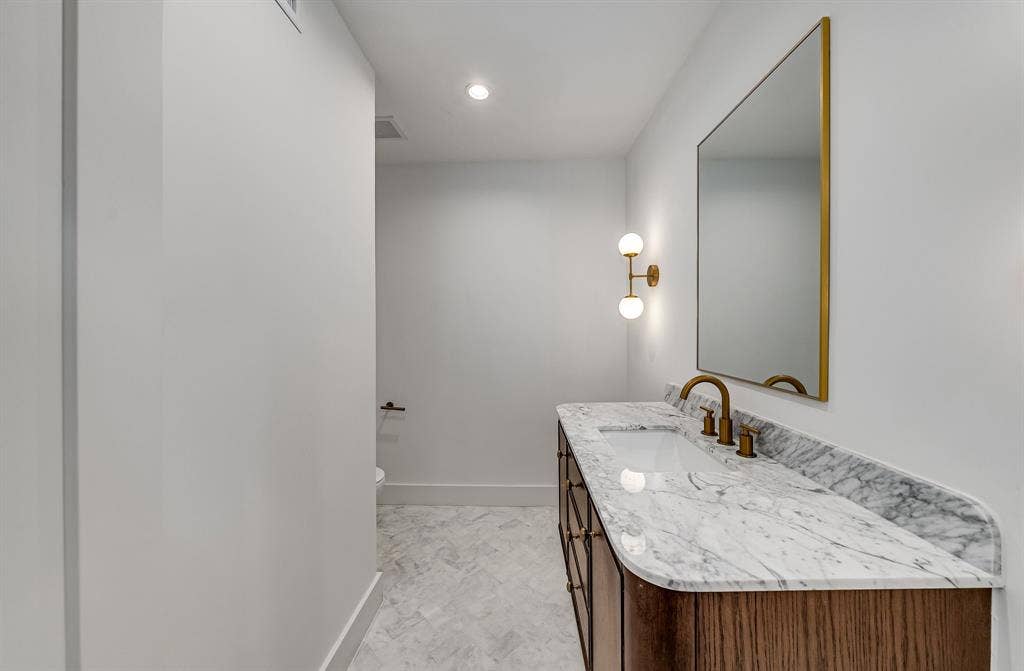 6275 Preston Creek Drive, Dallas, TX 75240 Half bathroom with vanity and recessed lighting