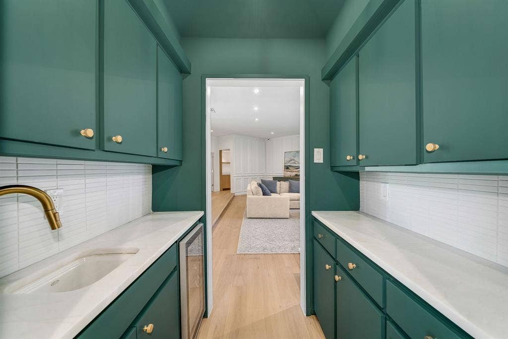 6275 Preston Creek Drive, Dallas, TX 75240 Bar with green cabinets, tasteful backsplash, and wine cooler