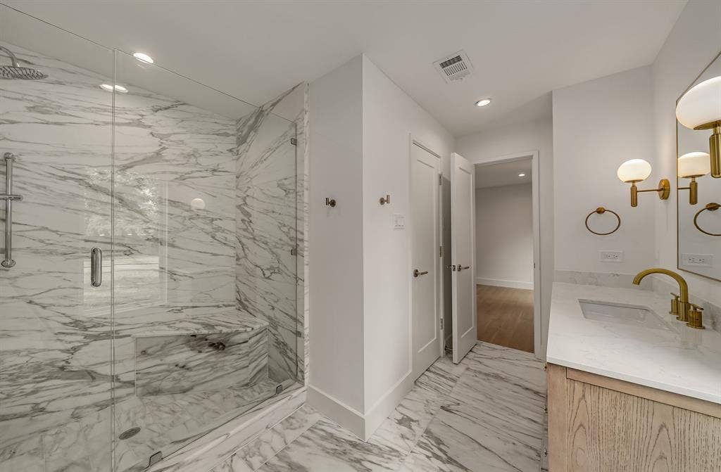 6275 Preston Creek Drive, Dallas, TX 75240 Full bath featuring vanity, a marble finish shower, light marble finish flooring, and recessed lighting