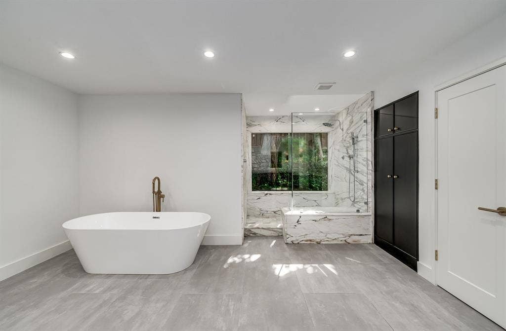 6275 Preston Creek Drive, Dallas, TX 75240 Full bathroom featuring a freestanding bath, recessed lighting, and a marble finish shower