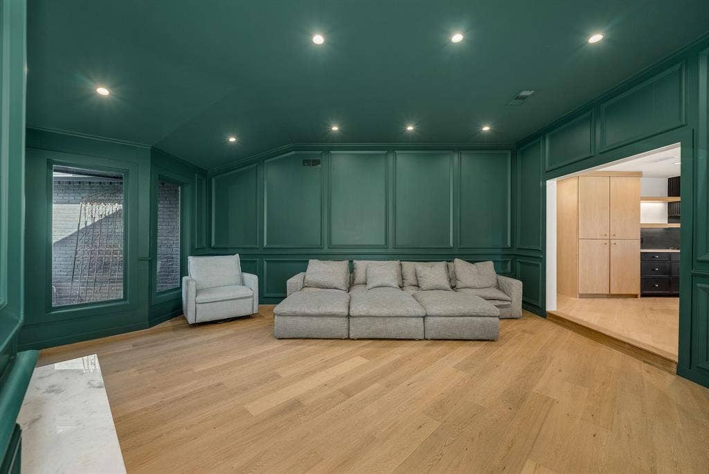6275 Preston Creek Drive, Dallas, TX 75240 Living room featuring a decorative wall, vaulted ceiling, light wood-type flooring, and recessed lighting