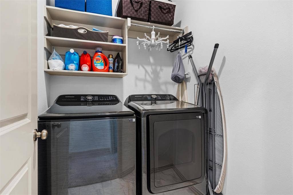 Space for full sized washer and dryer.