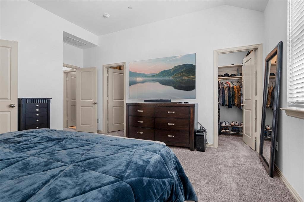 Primary bedroom with two walk in closets