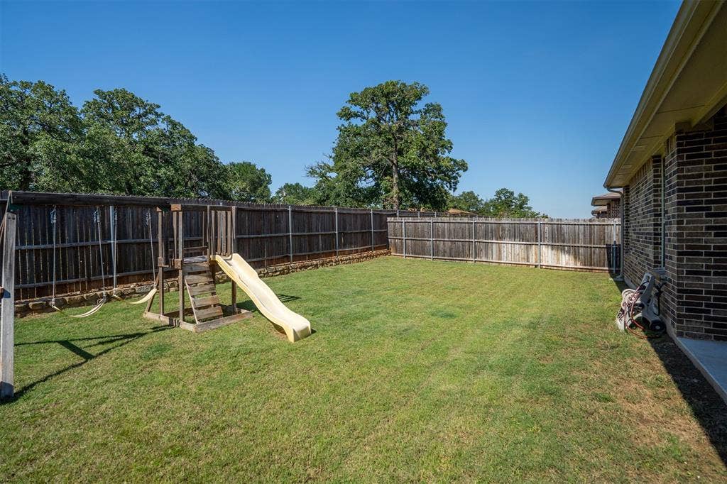 Backyard- playground stays with the home