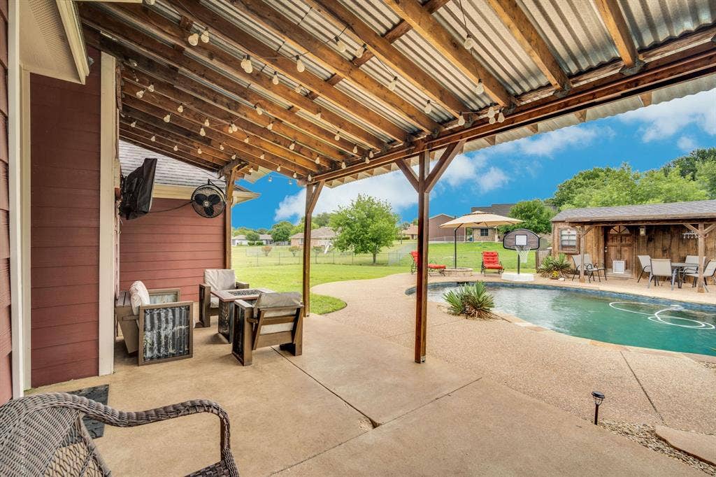 4431 Kings Court, Midlothian, TX 76065 Covered patio leading out to remodeled pool.