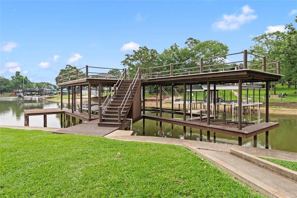 1524 Villa Cove Drive, Tool, TX 75143 Large covered boathouse with two boat slips, jet ski slip, and direct lake access—perfect for boating, fishing, or watersports.