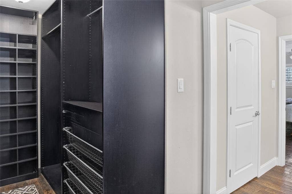 690 Orchid Hill Lane, Copper Canyon, TX 76226 Primary custom-built closet. You will love the spacious closet with many built-ins to organize your close and shoes