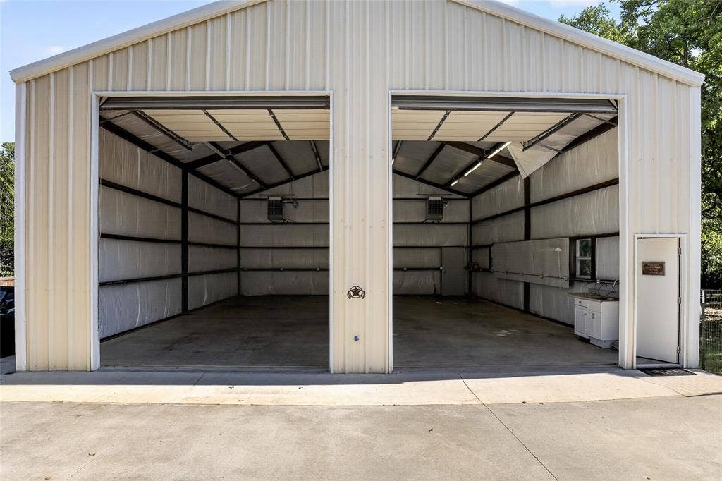 690 Orchid Hill Lane, Copper Canyon, TX 76226 This is one of the most unbelievable 30x50 workshops! It is heated with its own propane tank, has a utility sink and large doors to accommodate RV parking