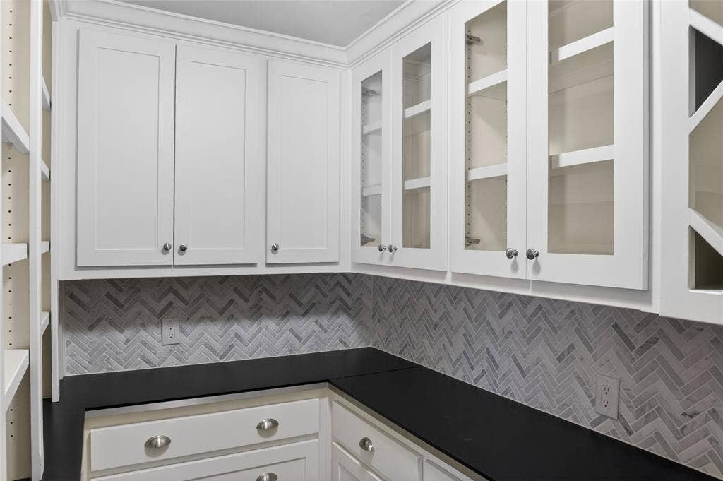 690 Orchid Hill Lane, Copper Canyon, TX 76226 One of the greatest features of this kitchen is the huge walk-in custom pantry - there's so much counterspace and cabinets to keep things organized and well displayed