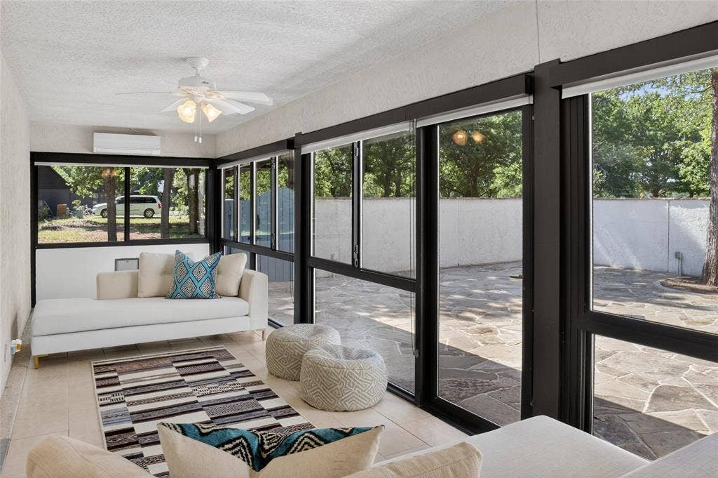 690 Orchid Hill Lane, Copper Canyon, TX 76226 Covered sunroom with direct access from the living room that leads to patio/courtyard area.