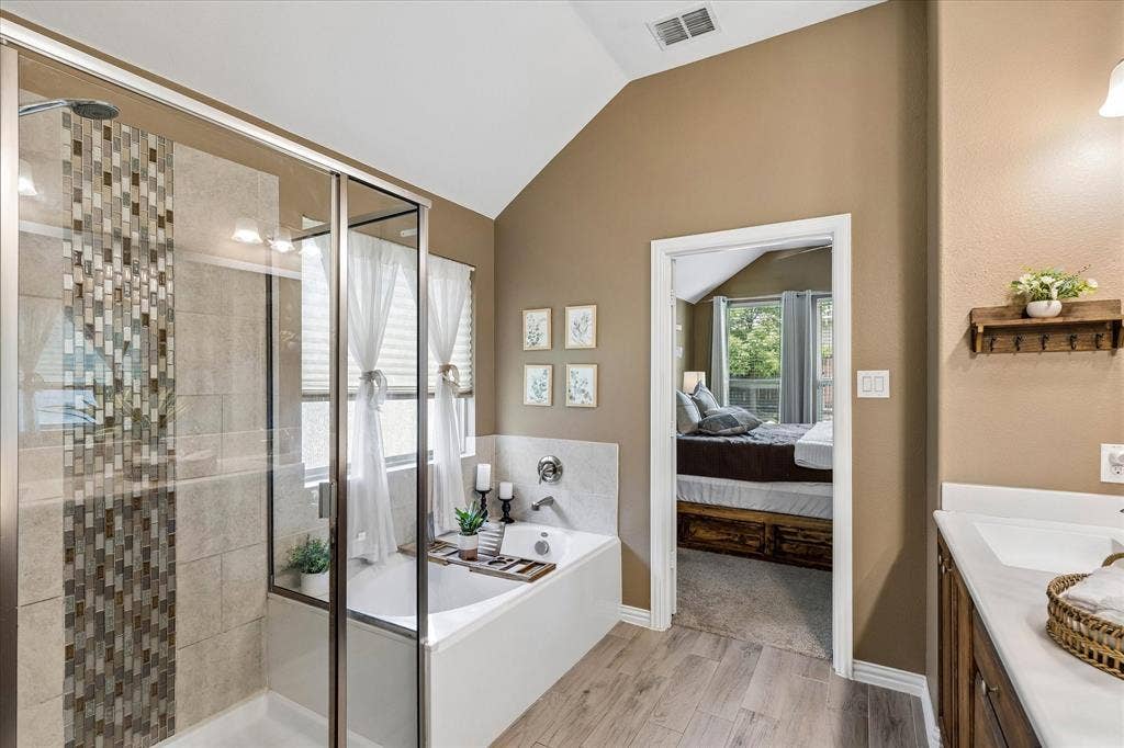 14824 Rocky Face Lane, Fort Worth, TX 76052 Primary bathroom with a relaxing soak tub and a tiled walk in shower.