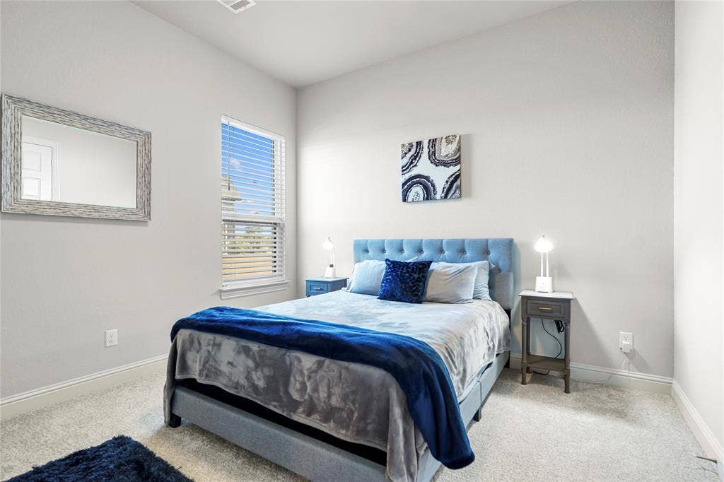 Light-colored carpeting complements neutral wall tones