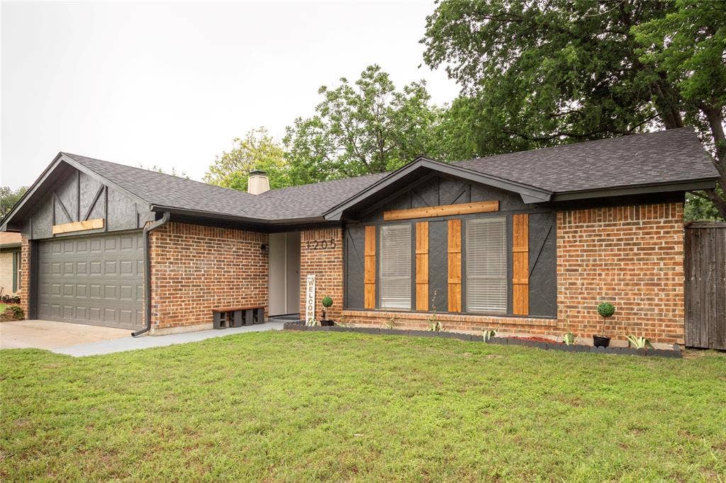 1205 Augusta Road, Benbrook, TX 76126 Brick and dark gray siding exterior with a charcoal shingle roof