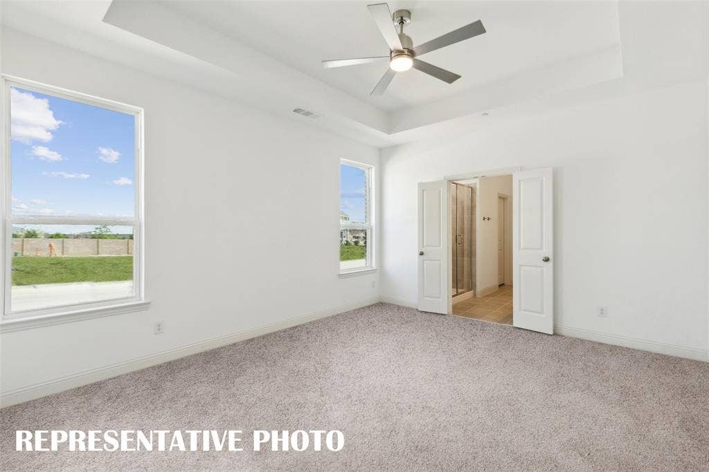 1026 Splitrock Drive, Allen, TX 75013 This dreamy owner's suite offers high ceilings, large windows and a grand double door entrance into the perfect owner's bath! REPRESENTATIVE PHOTO