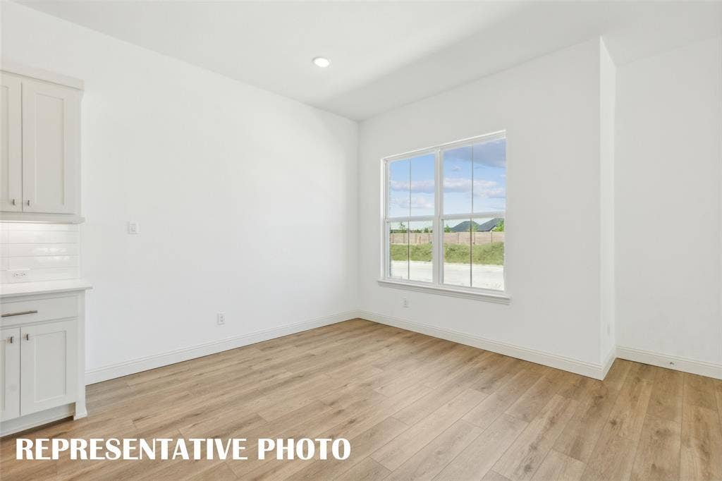 1026 Splitrock Drive, Allen, TX 75013 This dining area features oversized windows and space for a table large enough to seat the entire family! REPRESENTATIVE PHOTO