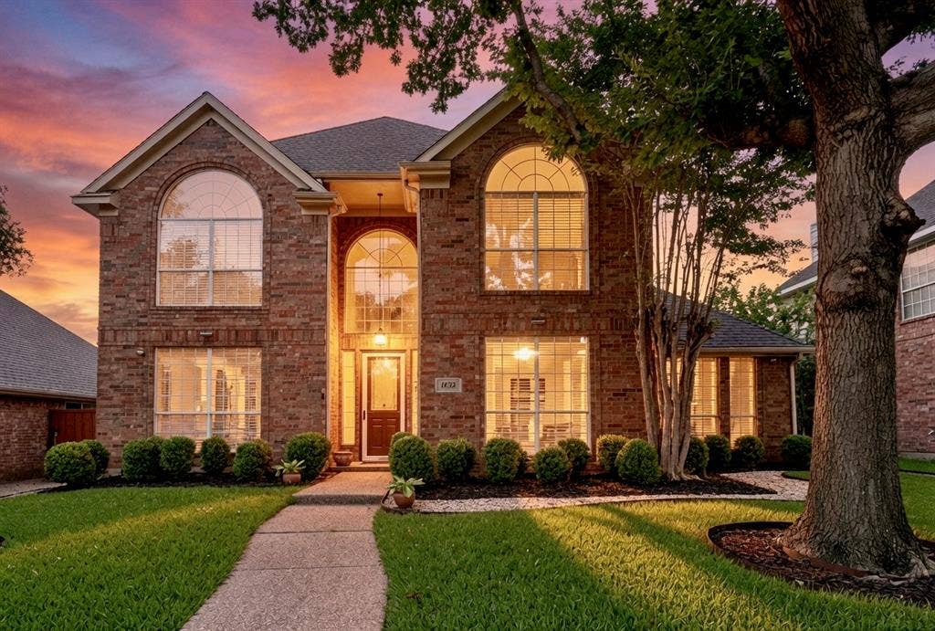1432 Honey Locust Drive, Plano, TX 75023 Font elevations, property faces North. Virtually staged sunset sky.