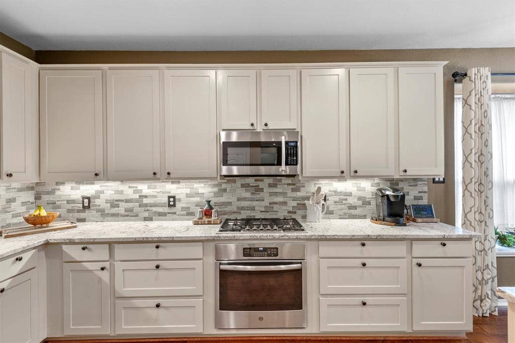 Gas cook top lots of cabinets with under lighting