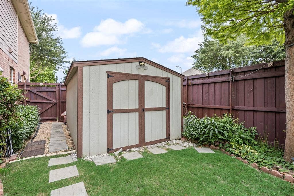 1501 Weathered Wood Lane, Garland, TX 75040 Side yard storage shed