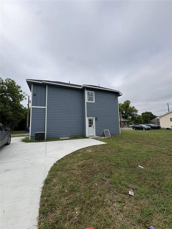 316 Henry Street, Waxahachie, TX 75165 Two-story exterior with blue horizontal siding and white trim