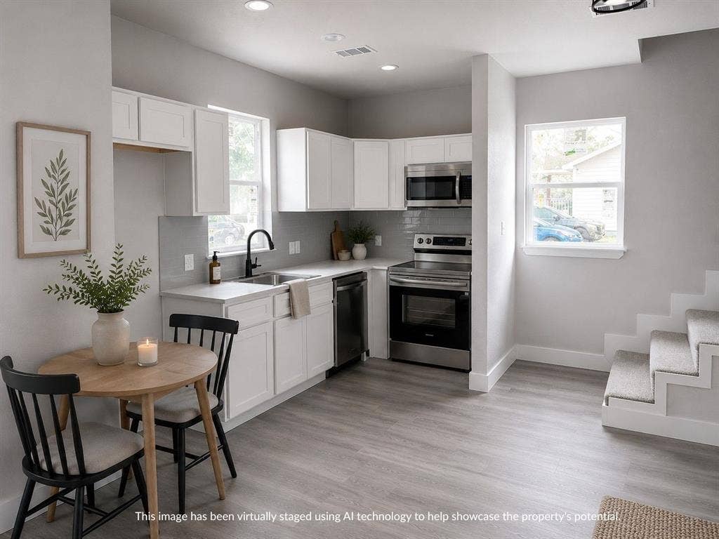316 Henry Street, Waxahachie, TX 75165 Modern kitchen featuring white cabinetry, stainless steel appliances, a light-toned backsplash, light wood-finish flooring, and recessed lighting