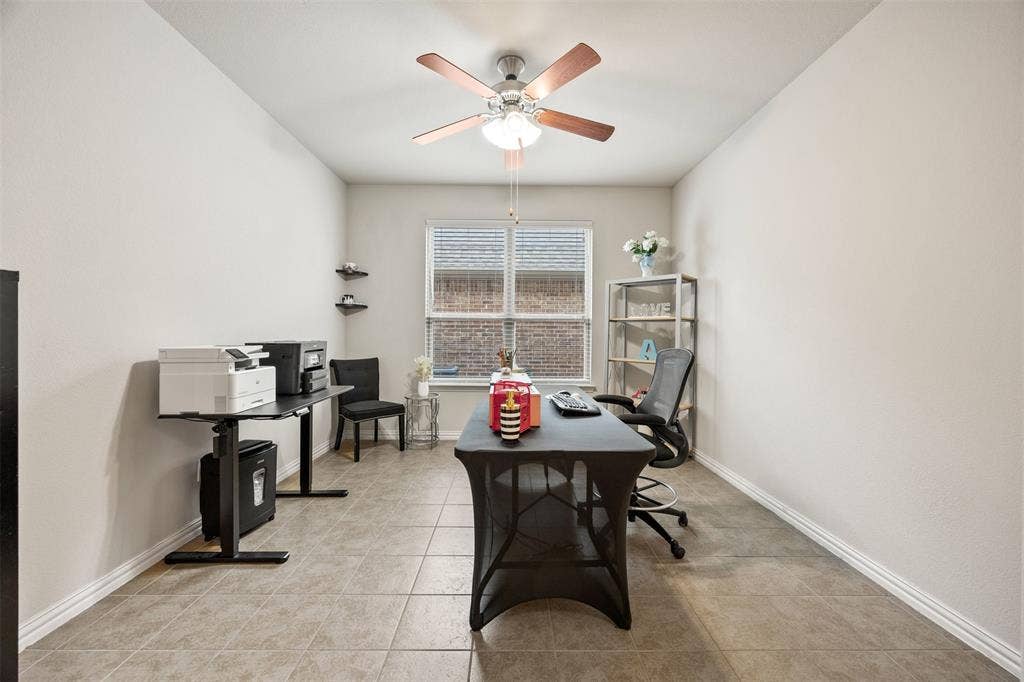 1437 Tanglewood Trail, Northlake, TX 76226 Spacious room featuring neutral paint, tiled flooring, a window with horizontal blinds, and a ceiling fan with light fixture