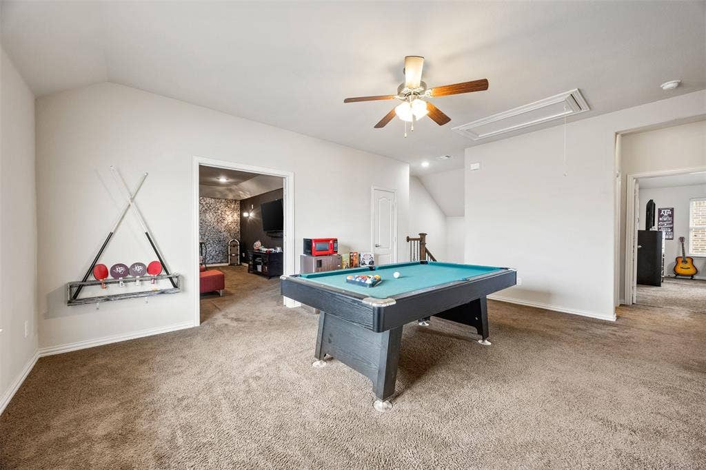 1437 Tanglewood Trail, Northlake, TX 76226 Spacious bonus room featuring vaulted ceilings, a ceiling fan with integrated lighting, and carpet flooring