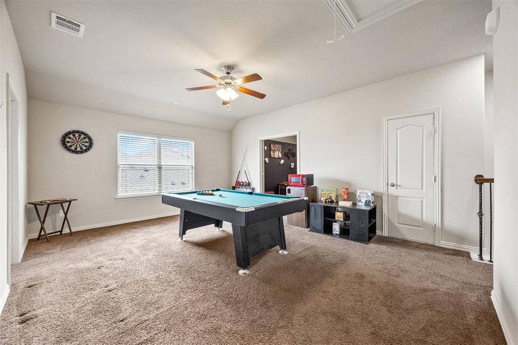 1437 Tanglewood Trail, Northlake, TX 76226 Spacious room featuring neutral carpeting, a large window with horizontal blinds, and a ceiling fan with integrated lighting