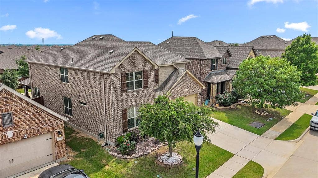 1437 Tanglewood Trail, Northlake, TX 76226 Brick veneer exterior with a two-story design and a covered entry