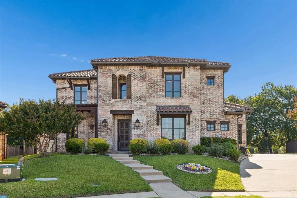 125 Audrey Drive, Keller, TX 76248 Beautiful Tuscan Style Home with landscaping and beautiful front door.