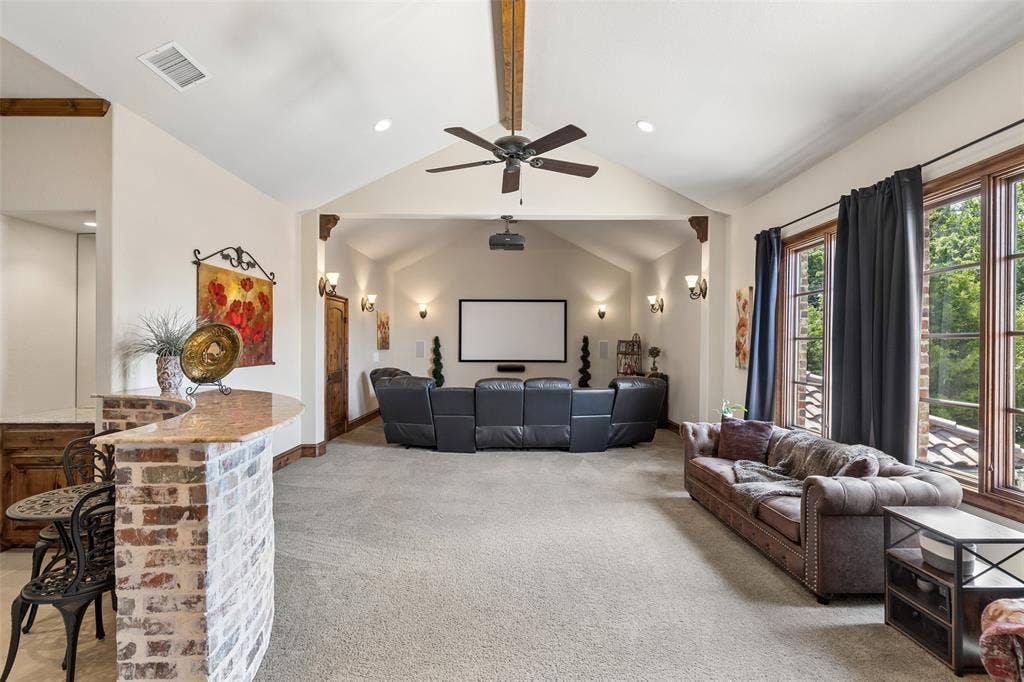 125 Audrey Drive, Keller, TX 76248 Very large flex room upstairs featuring a ceiling fan, space for media equipment and a small kitchen. Can be used for a game room or media room. Small kitchen features a full size refrigerator, a sink and plenty of cabinet space.