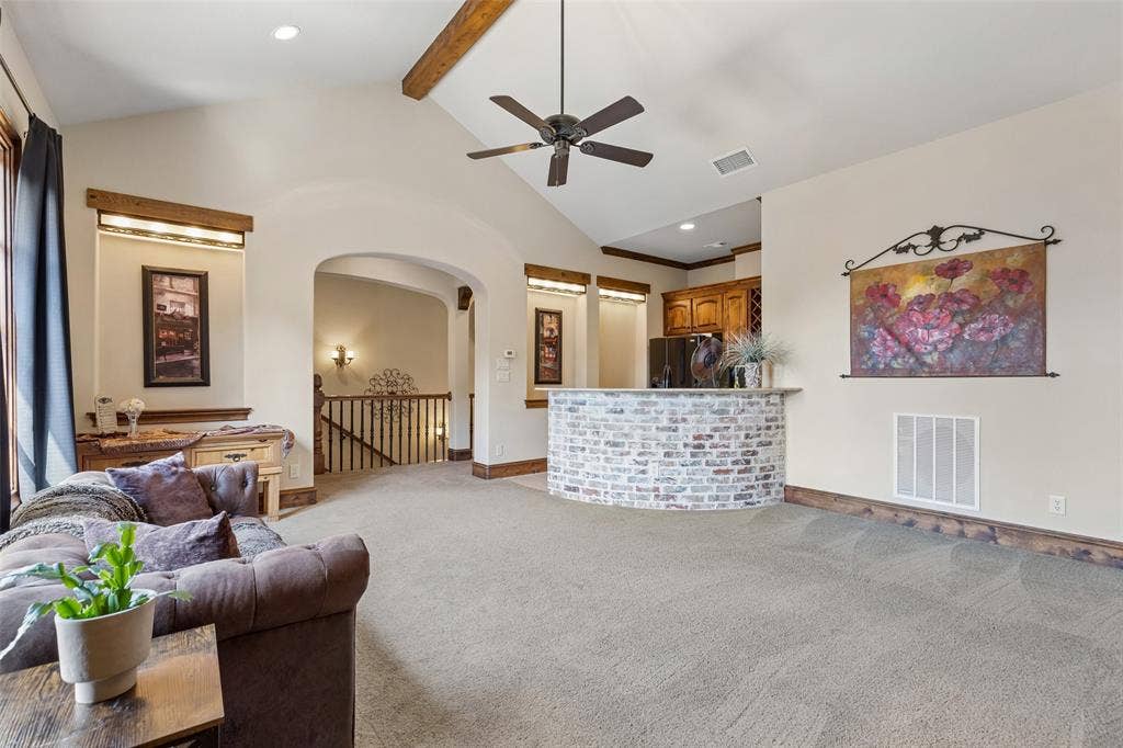 125 Audrey Drive, Keller, TX 76248 Very large flex room upstairs featuring a ceiling fan, space for media equipment and a small kitchen. Can be used for a game room or media room. Small kitchen features a full size refrigerator, a sink and plenty of cabinet space.