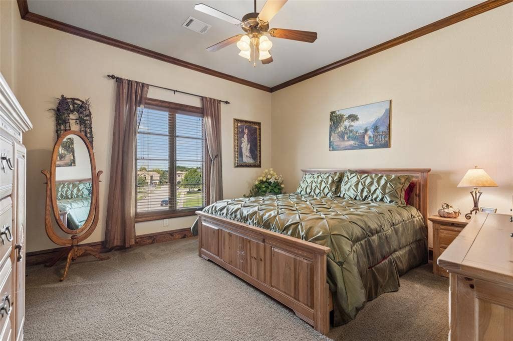 125 Audrey Drive, Keller, TX 76248 Bedroom 3 located upstairs featuring a walk in closet, ceiling fan, large window and carpet.