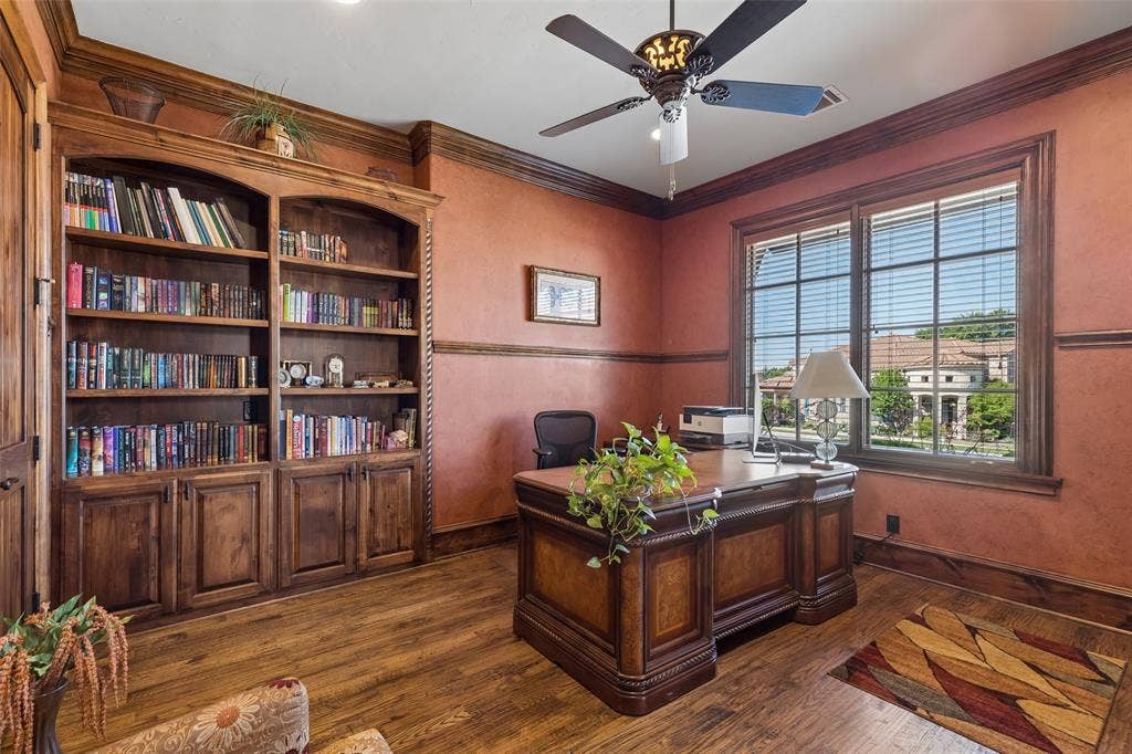 125 Audrey Drive, Keller, TX 76248 Office featuring beautiful hardwood floors, ceiling fan, built in cabinets and extra storage under the stairs.