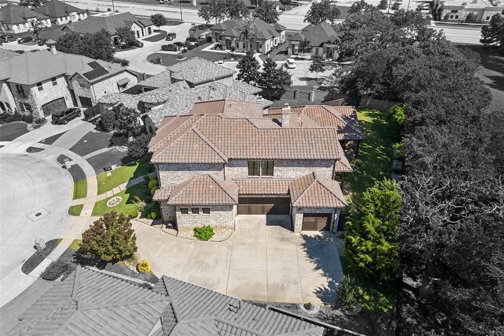 125 Audrey Drive, Keller, TX 76248 Aerial view of the 3 car garage. A double door and a single door.