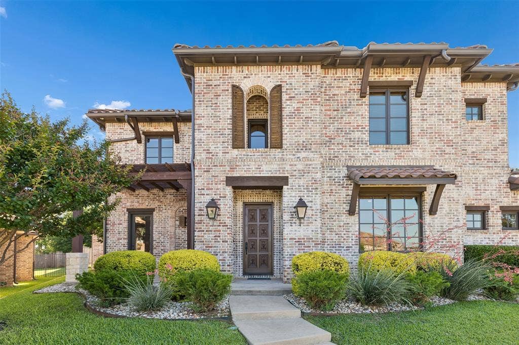 125 Audrey Drive, Keller, TX 76248 Beautiful Tuscan Style Home with landscaping and beautiful front door.
