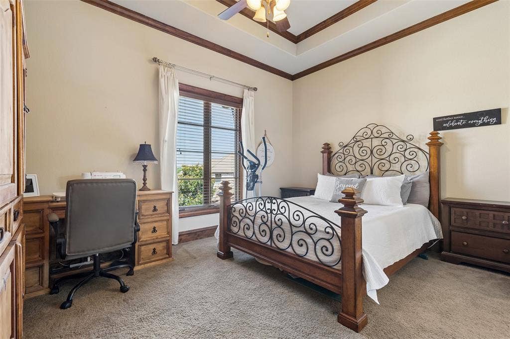 125 Audrey Drive, Keller, TX 76248 Bedroom 4 located on the second floor featuring a ceiling fan, carpet and an ensuite bathroom with a walk in closet.