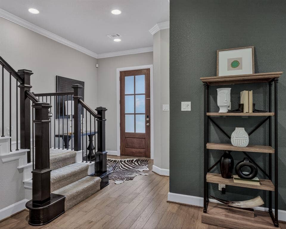 6301 Millie Way, McKinney, TX 75070 Inviting and well appointed entryway showcasing hardwood floors throughout.