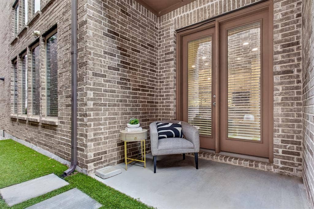 6301 Millie Way, McKinney, TX 75070 Private side patio featuring a low-maintenance turf area — perfect for relaxing, entertaining, or enjoying outdoor living year-round.