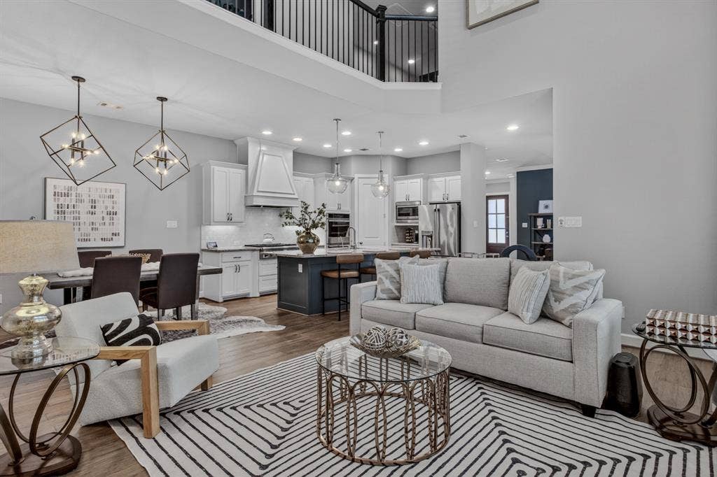 6301 Millie Way, McKinney, TX 75070 Grand open living space with high ceilings that fills the home with light and an inviting sense of openness.