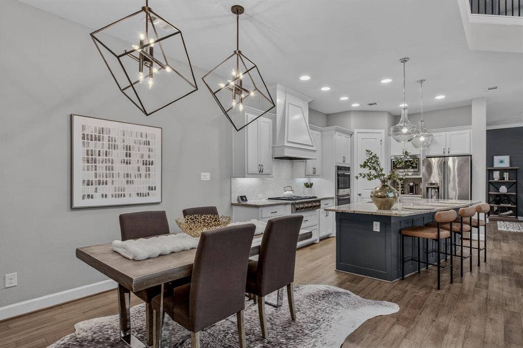 6301 Millie Way, McKinney, TX 75070 Modern light fixture adorn the dining room