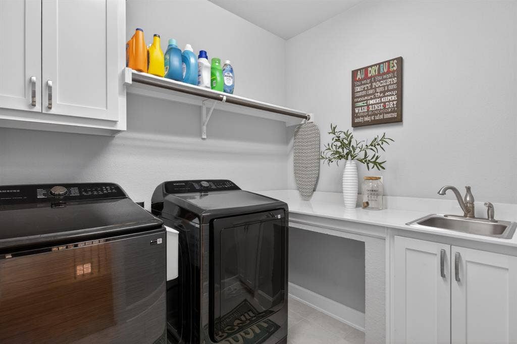 6301 Millie Way, McKinney, TX 75070 Functional laundry area with ample storage space to keep everything organized and convenient.