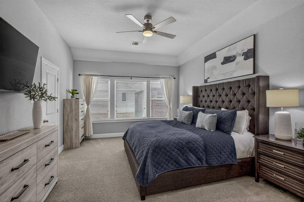 6301 Millie Way, McKinney, TX 75070 Spacious primary bedroom filled with natural light.