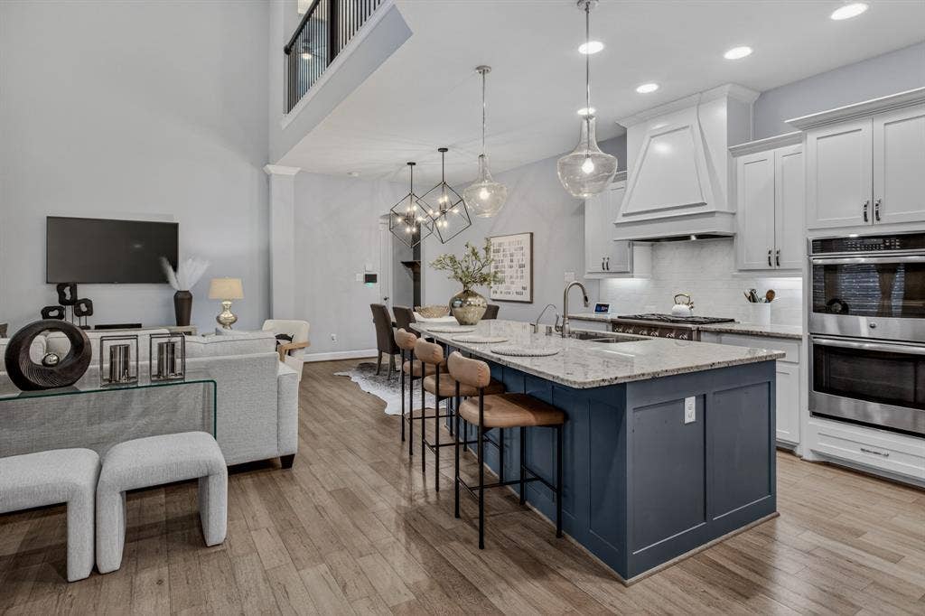 6301 Millie Way, McKinney, TX 75070 Open kitchen and living room great for entertaining