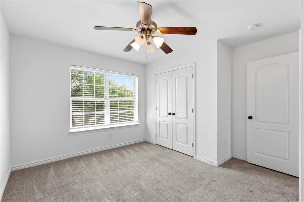 544 Hubbard Circle, Nevada, TX 75173 White-painted interior with carpet flooring
