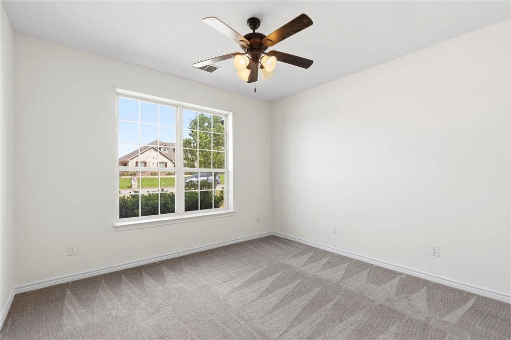 544 Hubbard Circle, Nevada, TX 75173 Bright interior room with a large window overlooking the neighborhood