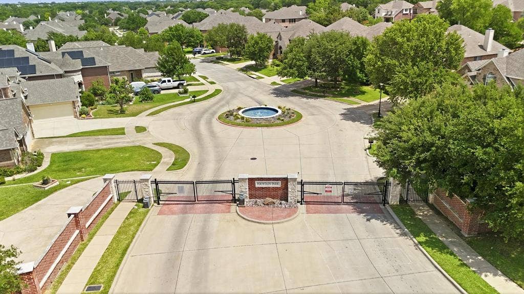 201 Fountainview Drive, Euless, TX 76039 The front entrance of the subdivision features wrought iron gates and a beautiful fountain. It sets the tone for this amazing neighborhood!