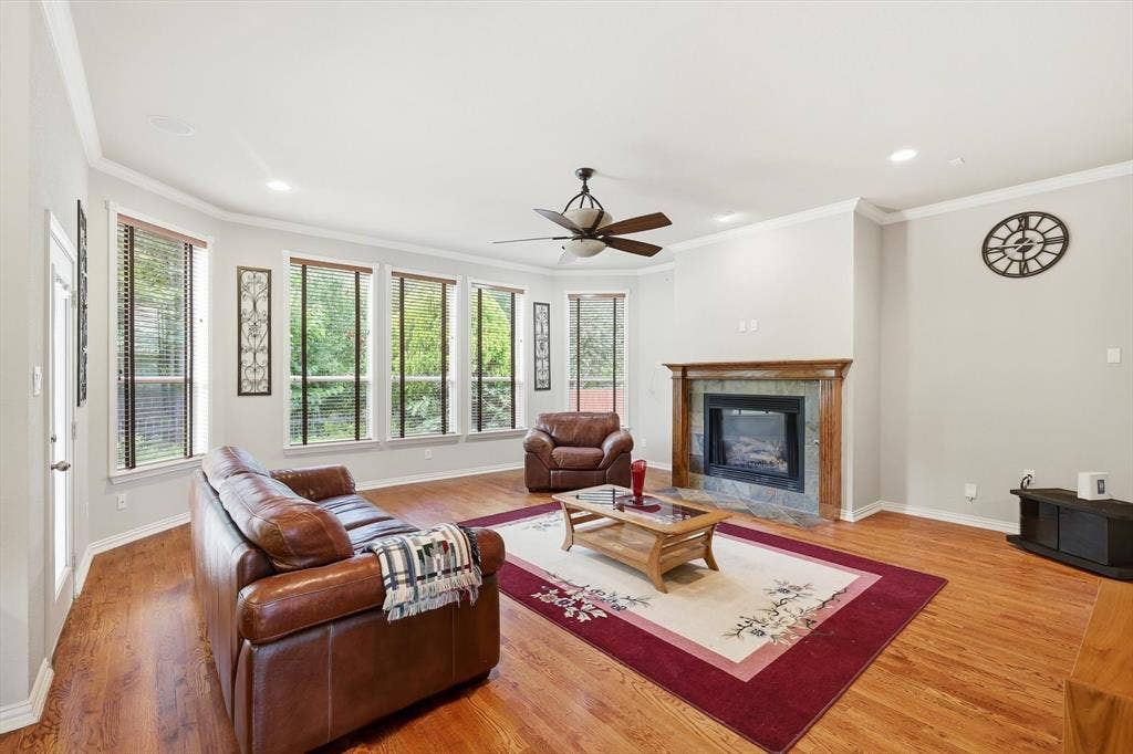 201 Fountainview Drive, Euless, TX 76039 Spacious living area with warm, real hardwood flooring overlooks the nature preserve.