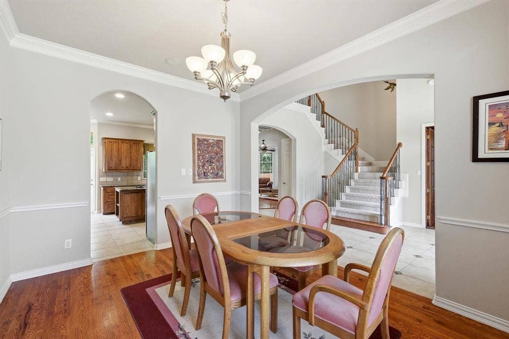 201 Fountainview Drive, Euless, TX 76039 Dining area features crown molding and true hardwood flooring.