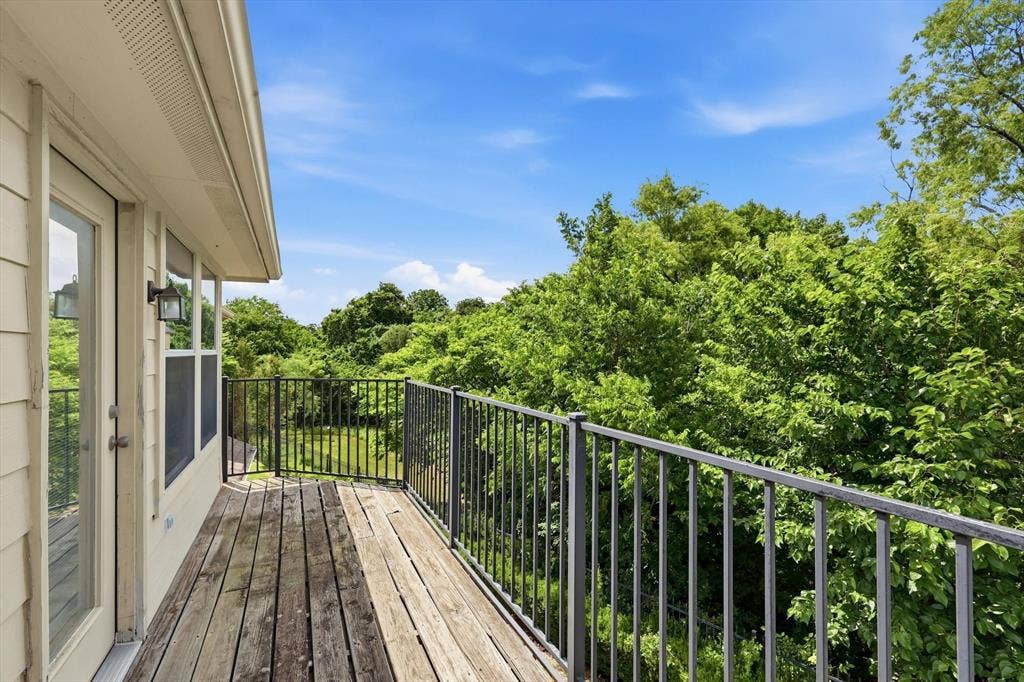 201 Fountainview Drive, Euless, TX 76039 Primary bedroom opens up to this private balcony with picturesque views of the nature preserve.