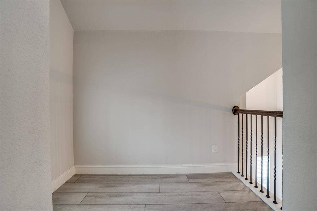2811 Killdeer Trail, Prosper, TX 75078 Unfurnished room featuring light wood-type flooring and baseboards